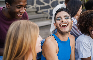 Young diverse people having fun outdoor laughing together - Focus on gay man face