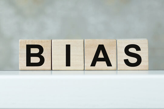 Wooden blocks with the word Bias. Prejudice. Personal opinions.