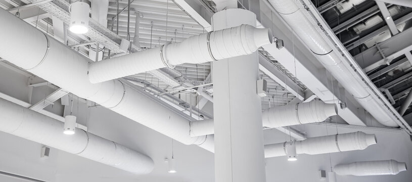 Ventilation pipes hvac duct tube hanging from ceiling store inside for conditioner air