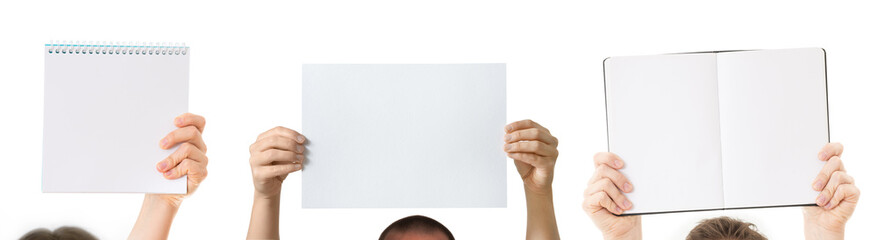 group of people with hands holding blank notebooks isolated
