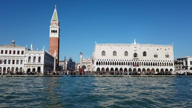 Europe, Venice November 2021  Europe, Italy , Venice - Piazza San Marco and 
Ducal Palace ( doges palace )  with Clock tower view from the boat gondola in Venetian lagoon 