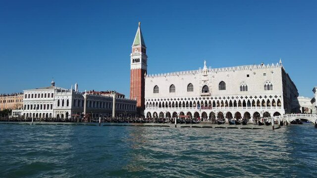 Europe, Venice November 2021  Europe, Italy , Venice - Piazza San Marco and 
Ducal Palace ( doges palace )  with Clock tower view from the boat gondola in Venetian lagoon 