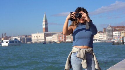 Europe, Venice November 2021 Europe, Italy - young girl taking pictures in Venezia in Piazza San...