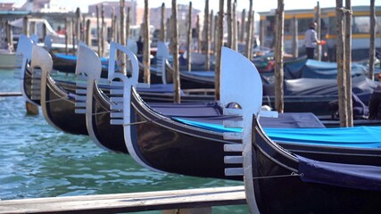 Fototapeta na wymiar Europe, Venice November 2021 - Italy , Venice - Ancient gondolas boats for tourists in the Venice lagoon - Resumption of tourism with the end of the lockdown due Covid-19 Coronavirus - Canal Grande