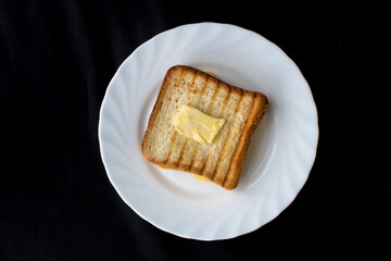 Toast with cheese on a plate, top view