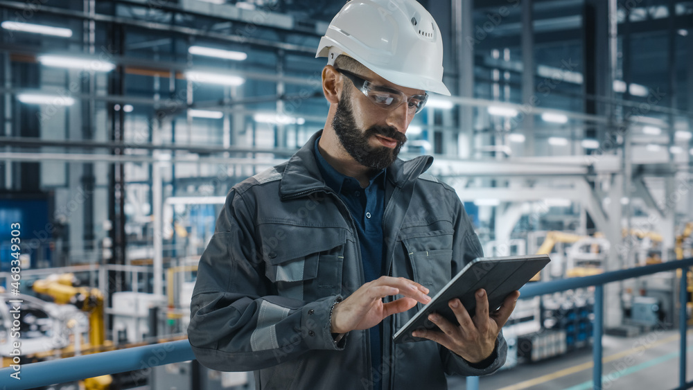 Poster Car Factory Engineer in Work Uniform Using Tablet Computer. Automotive Industrial Manufacturing Facility Working on Vehicle Production with Robotic Arms Technology. Automated Assembly Plant.