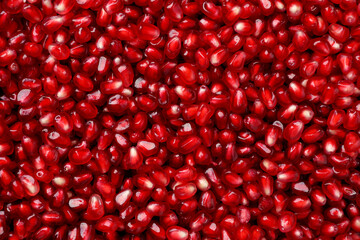 Tasty pomegranate seeds as background, top view