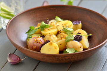 Simple salad with young potatoes with mustard-lime sauce