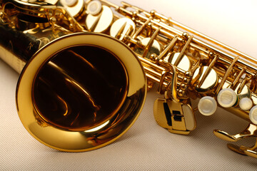 Alto saxophone close-up on white background - obrazy, fototapety, plakaty