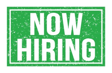 NOW HIRING, words on green rectangle stamp sign