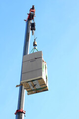 Industrial construction cranes on sky background