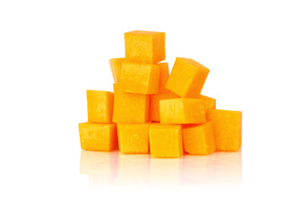 pumpkin cubes isolated on white. ripe pumpkin