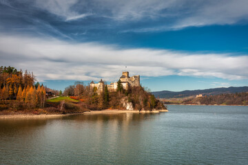 Medieval Castle in Niedzica with a reflection in the Czorsztyn Lake. Poland