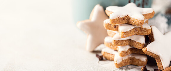 Stack of Christmas cinnamon cookies. Close up of gingerbread cookies. Winter holidays background banner with copy space