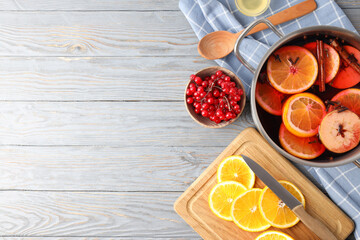 Concept of cooking  mulled wine on gray background