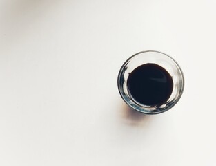 A glass of black coffee. Top view.