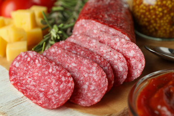 Сoncept of tasty food with salami sausage, close up