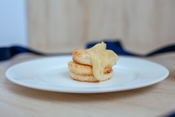 fresh cookies with cream on the white plate