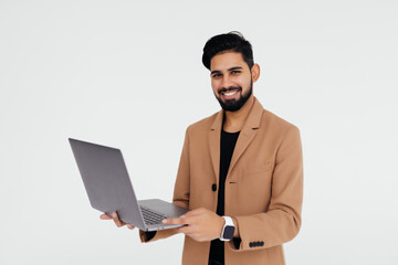 Indian Business man with a laptop isolated over a white background