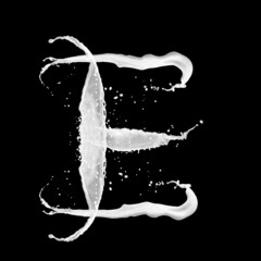 Letter E made of milk splash, isolated on black background