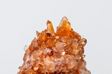 Macro of mineral stone Creedite on microcline on white background