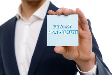 A businessman shows an inscription: PROJECT MANAGEMENT