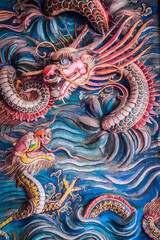 A mural art dragon sculpture at Cheng Hoon Teng Temple in Malacca, Malaysia.