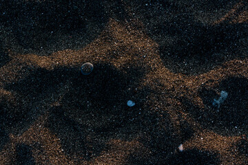 Natural sea sand in sunset lights. Natural wallpaper