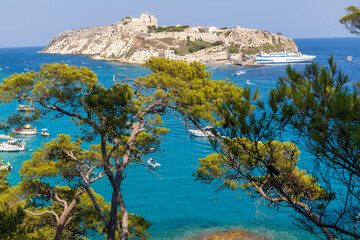 Breathtaking landscape of the Tremiti Islands with the crystal clear sea, vegetation and the island of San Nicola in the background of the archipelago of the Tremiti Islands, Puglia, Italy.