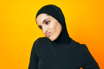 cheerful woman in black hijab posing fashion hand gesture studio lifestyle
