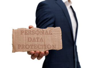 A businessman shows an inscription: PERSONAL DATA PROTECTION