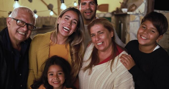Happy latin family smiling on camera 