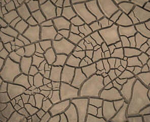 Cracked brown mud, surface texture of barren land