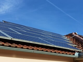solar panels on house  roof, forest for background , electricity ecology renewable energy