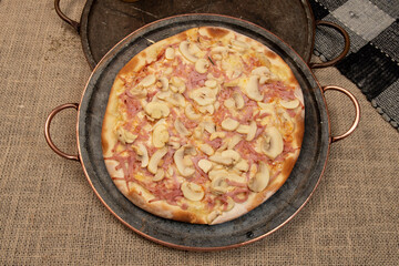 Brazilian pizza with mushroom, cheese and ham