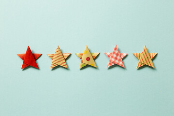 Five stars quality rating on blue background. top view