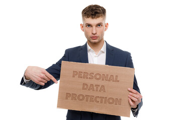 A businessman shows an inscription: PERSONAL DATA PROTECTION