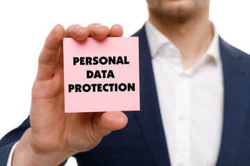 A businessman shows an inscription: PERSONAL DATA PROTECTION