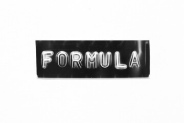 Black color banner that have embossed letter with word formula on white paper background