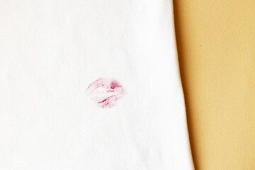 red lipstick kiss stain on white clothes