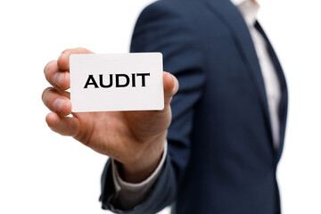 A businessman shows an inscription: AUDIT