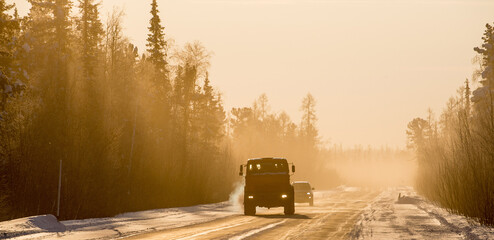 trucks driving on a winter road