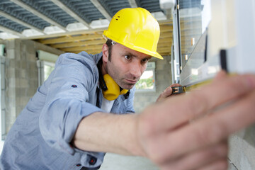technician with measurement level during work