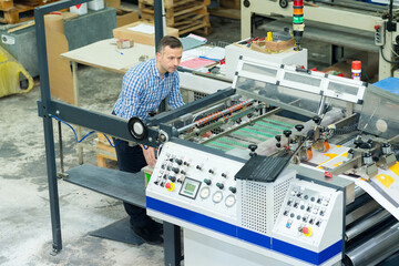 man working in printing factory