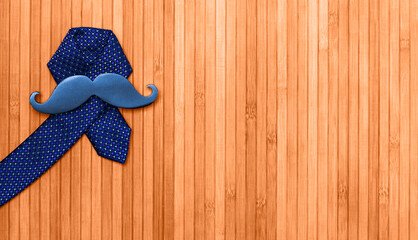 Prostate cancer symbol. Black mustache on a blue man's tie.