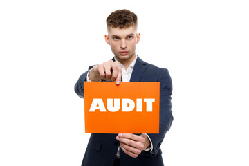 A businessman shows an inscription: AUDIT