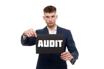 A businessman shows an inscription: AUDIT