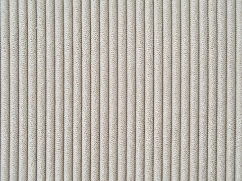 Light beige velour textile pattern with vertial stripes. Furniture sofa cover.