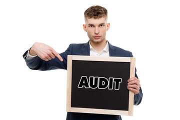 A businessman shows an inscription: AUDIT