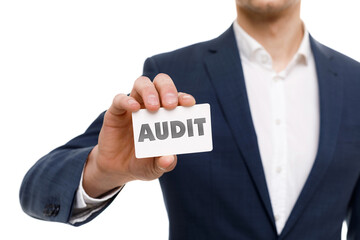 A businessman shows an inscription: AUDIT